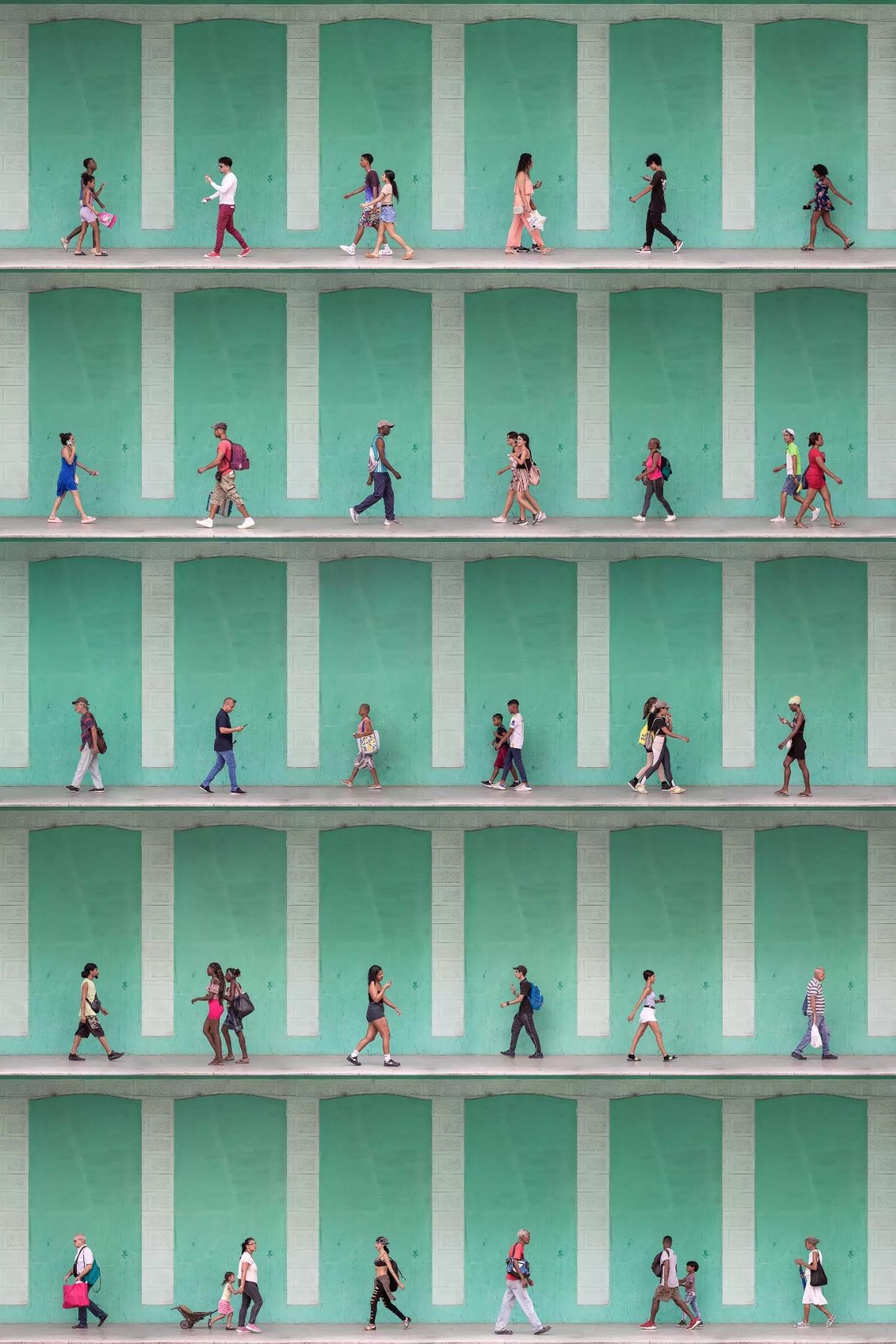 five rows of photos of people walking past teal-colored panels on cinderblock walls